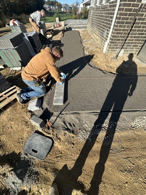 Setting paver border by hand